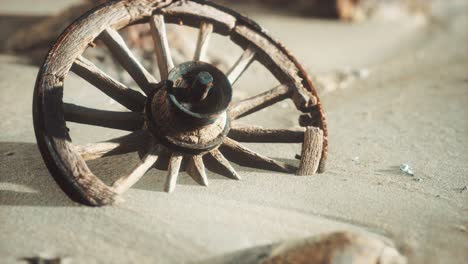 Large-wooden-wheel-in-the-sand